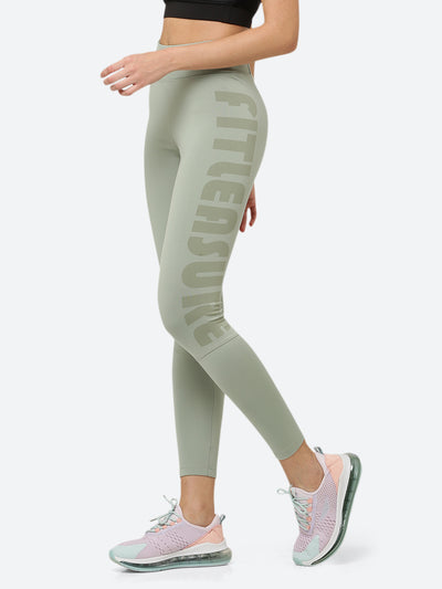 Fitleasure Signature Sporty women leggings in light olive green  is high on fashion ideal for workouts. Designed with sweat-free fabric, gives you the sporty, hardcore look